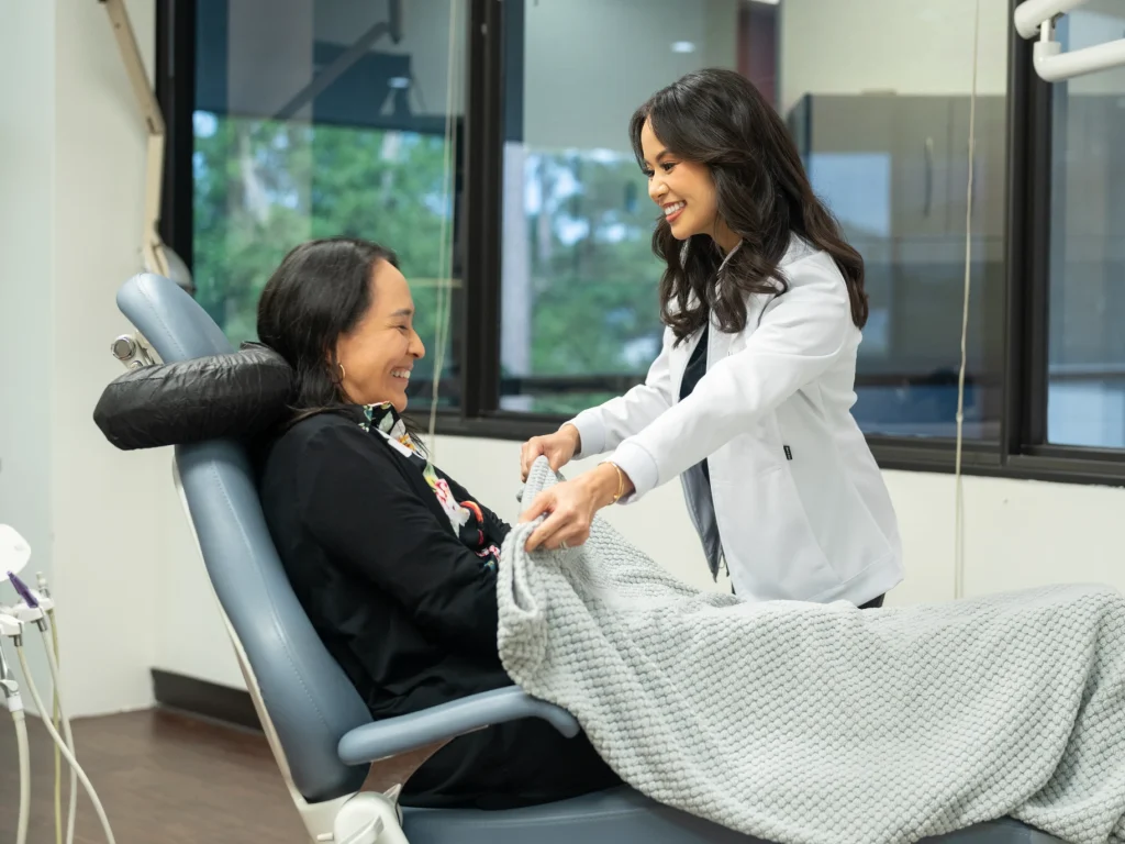 Caring Dr. Khong ensuring patient comfort during their visit | Conroe Dental Associates | Conroe, TX