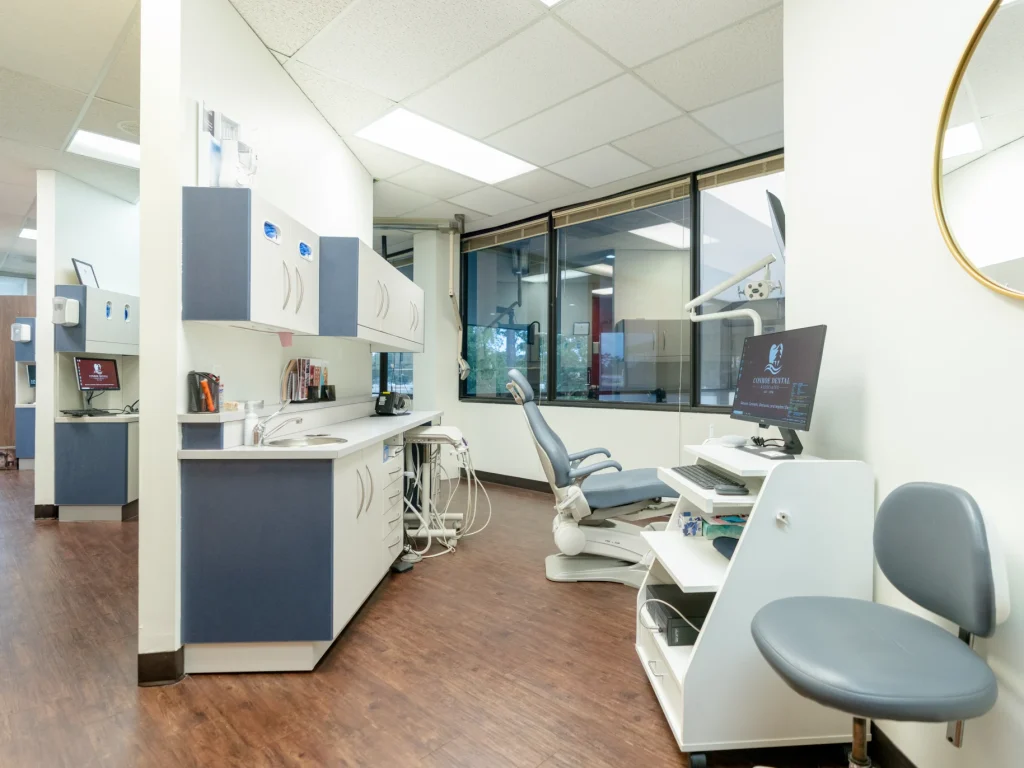Modern dental operatory with patient chair and equipment | Conroe Dental Associates | Conroe, TX
