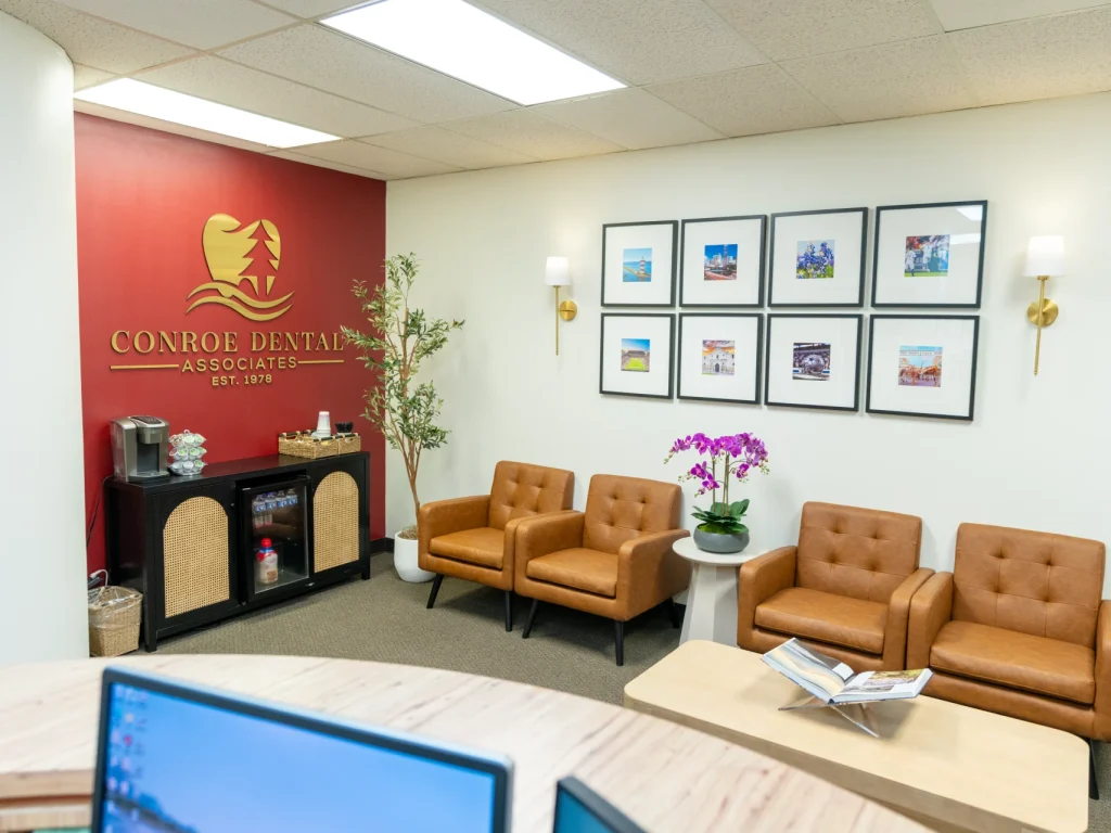 Conroe Dental Associates waiting room featuring the practice logo and patient seating | Conroe, TX
