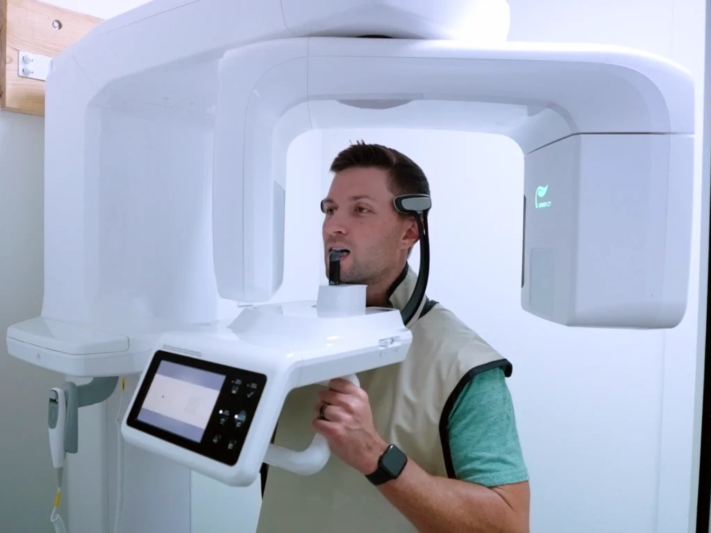 Man being scanned using a CBCT machine to get a 3D x-ray