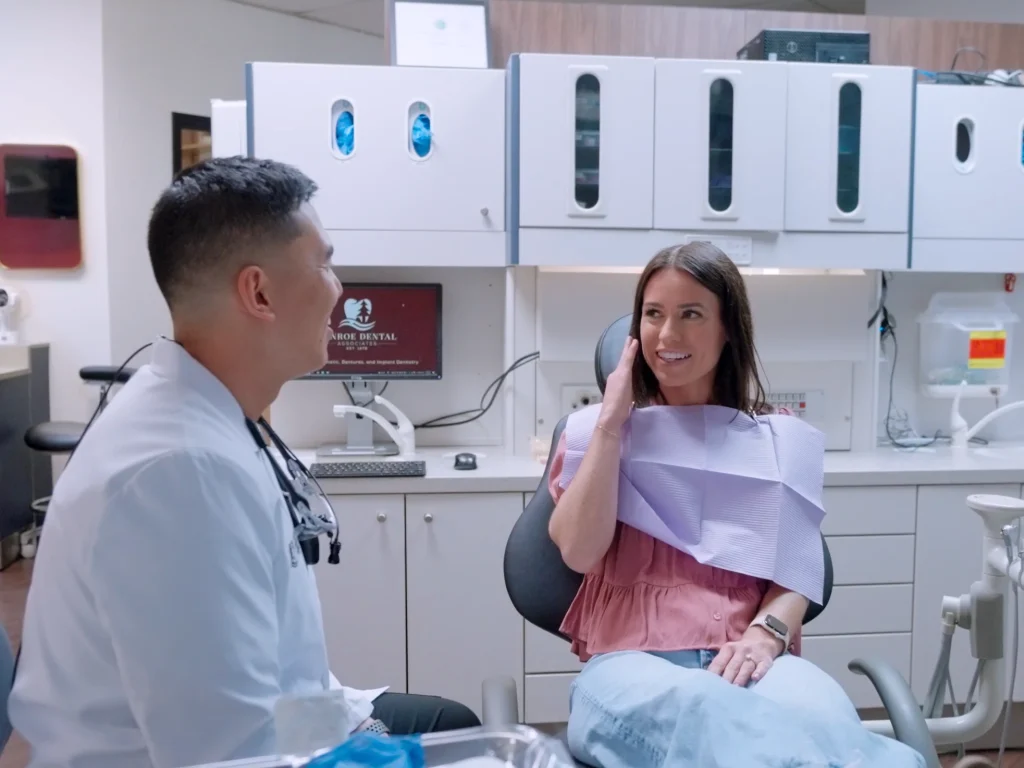 woman with tooth pain visiting an emergency dentist in Conroe, TX at Conroe Dental Associates